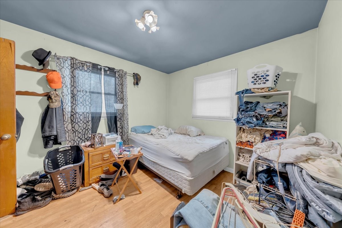 646 Main Street Altamont, TN 37301 - Photo 21 of 39 a bedroom with a bed and wooden floor