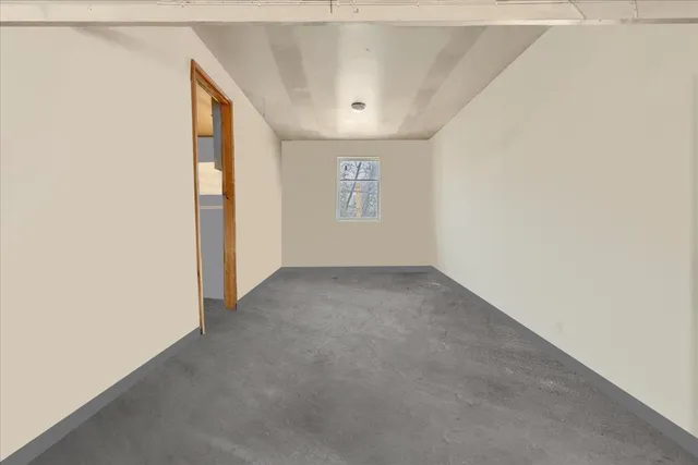 a view of a chair and table in the backyard