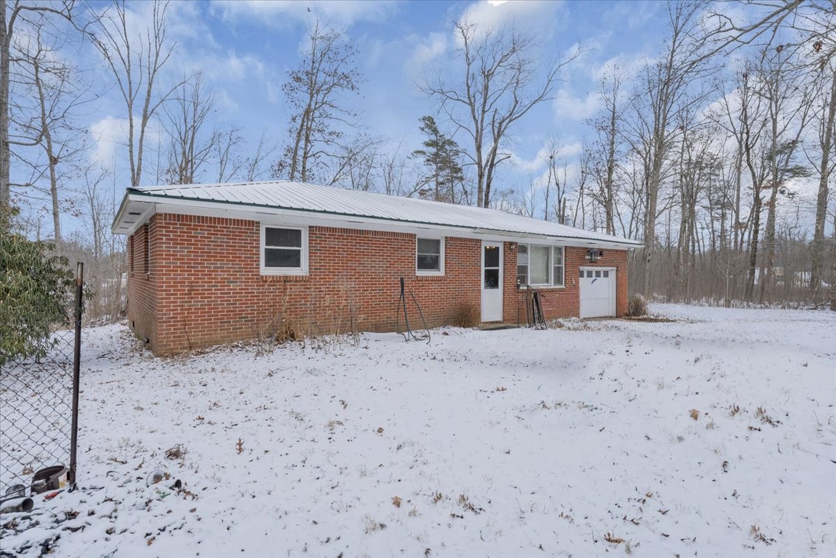 646 Main Street Altamont, TN 37301 - Photo 29 of 39 a view of a house with a yard