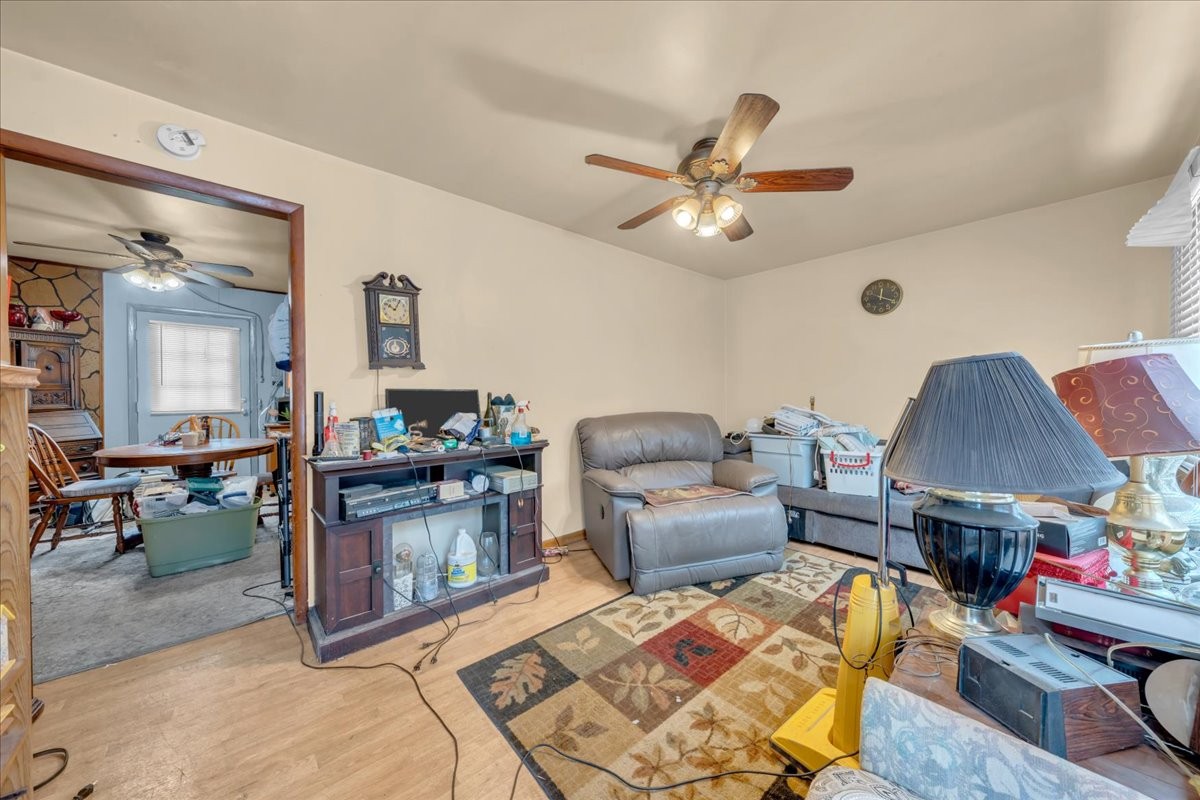 646 Main Street Altamont, TN 37301 - Photo 3 of 39 a living room with furniture a chandelier and a rug