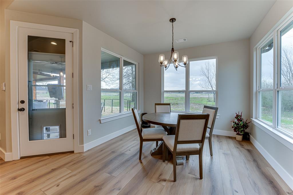 3167 County Road 1076 Celeste, TX 75423 - Photo 15 of 26 a dining room with furniture window wooden floor