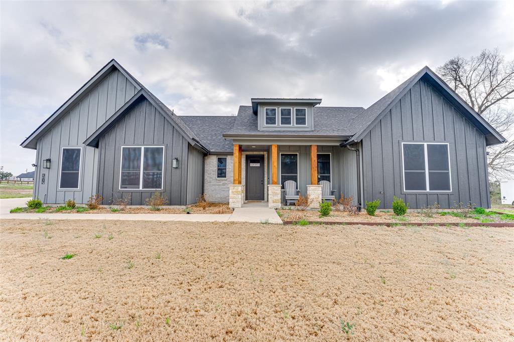 3167 County Road 1076 Celeste, TX 75423 - Photo 2 of 26 a front view of a house with a garden