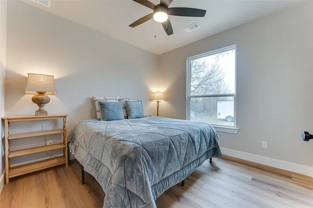 a bedroom with a bed and window