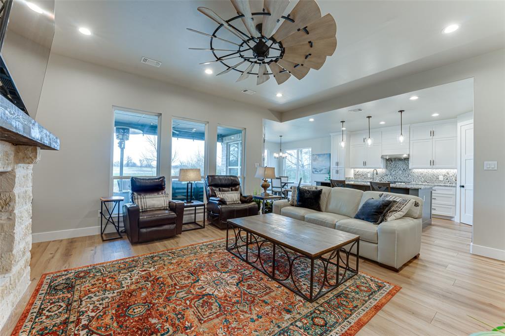3167 County Road 1076 Celeste, TX 75423 - Photo 6 of 26 a living room with furniture and a chandelier
