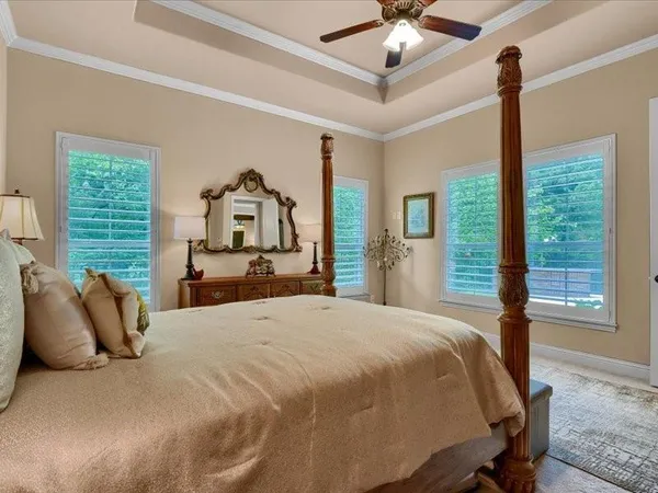 a bedroom with bed and window