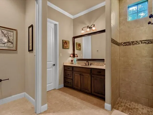 a bathroom with a double vanity sink and a mirror