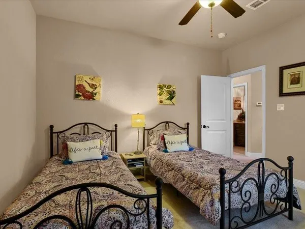 a bedroom that has a bed and a desk in it