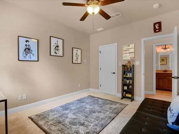 a living room with furniture and a rug