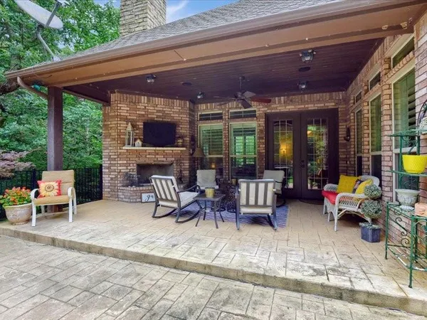 a view of a patio with chairs and a table