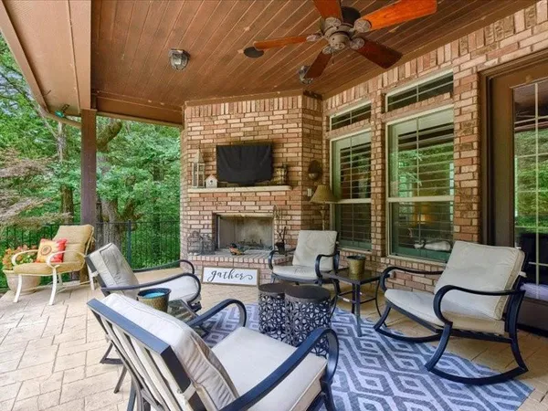 a view of a patio with a dining table and chairs