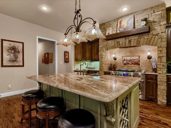 a kitchen with a table and chairs in it