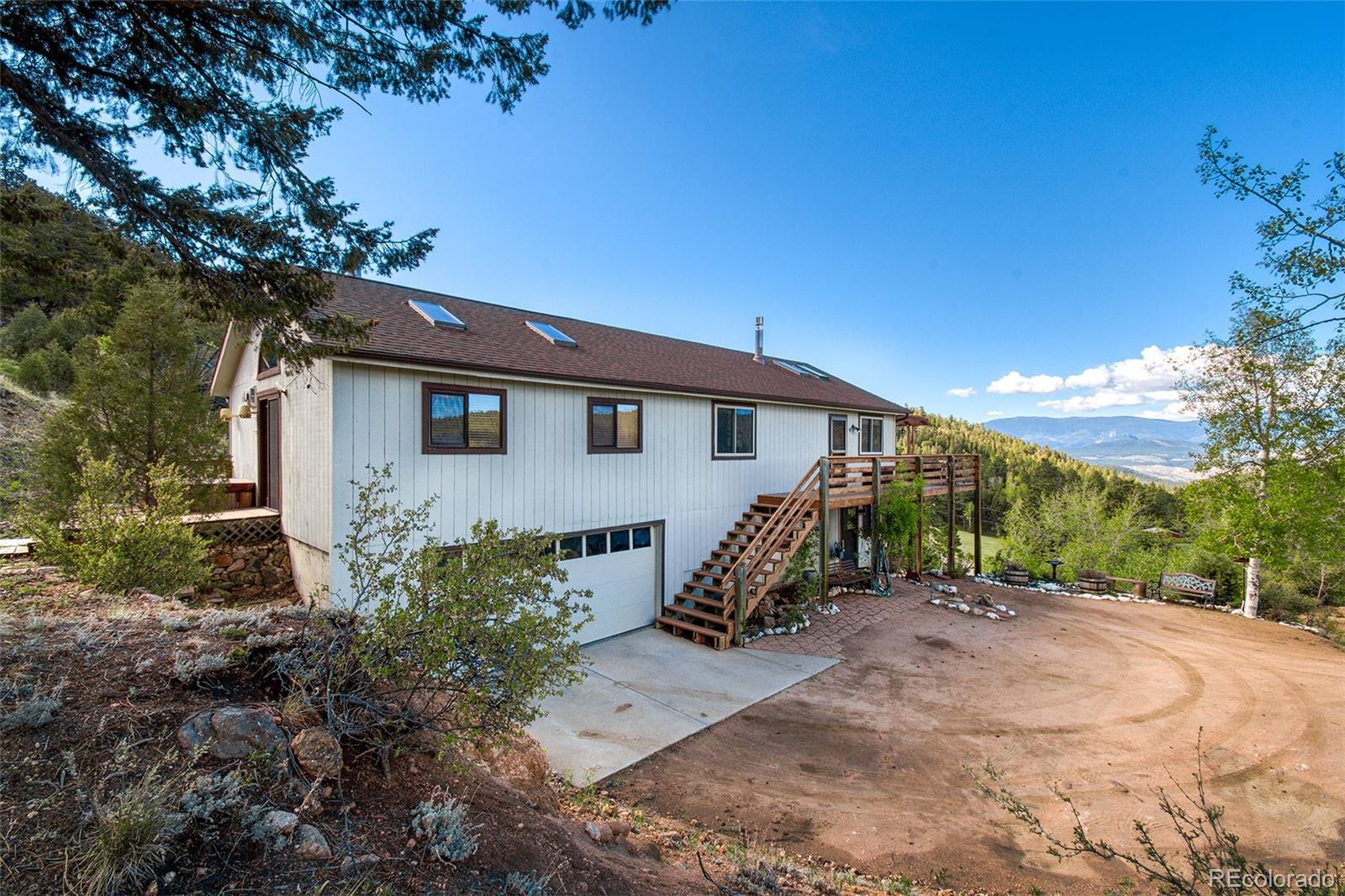 13976 Wamblee Trail Conifer, CO 80433 - Photo 28 of 39 a view of a house with a yard