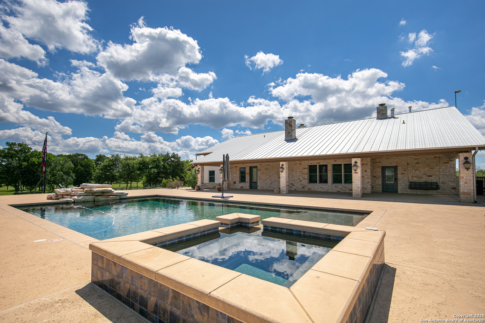 a view of a patio with swimming pool table and chairs