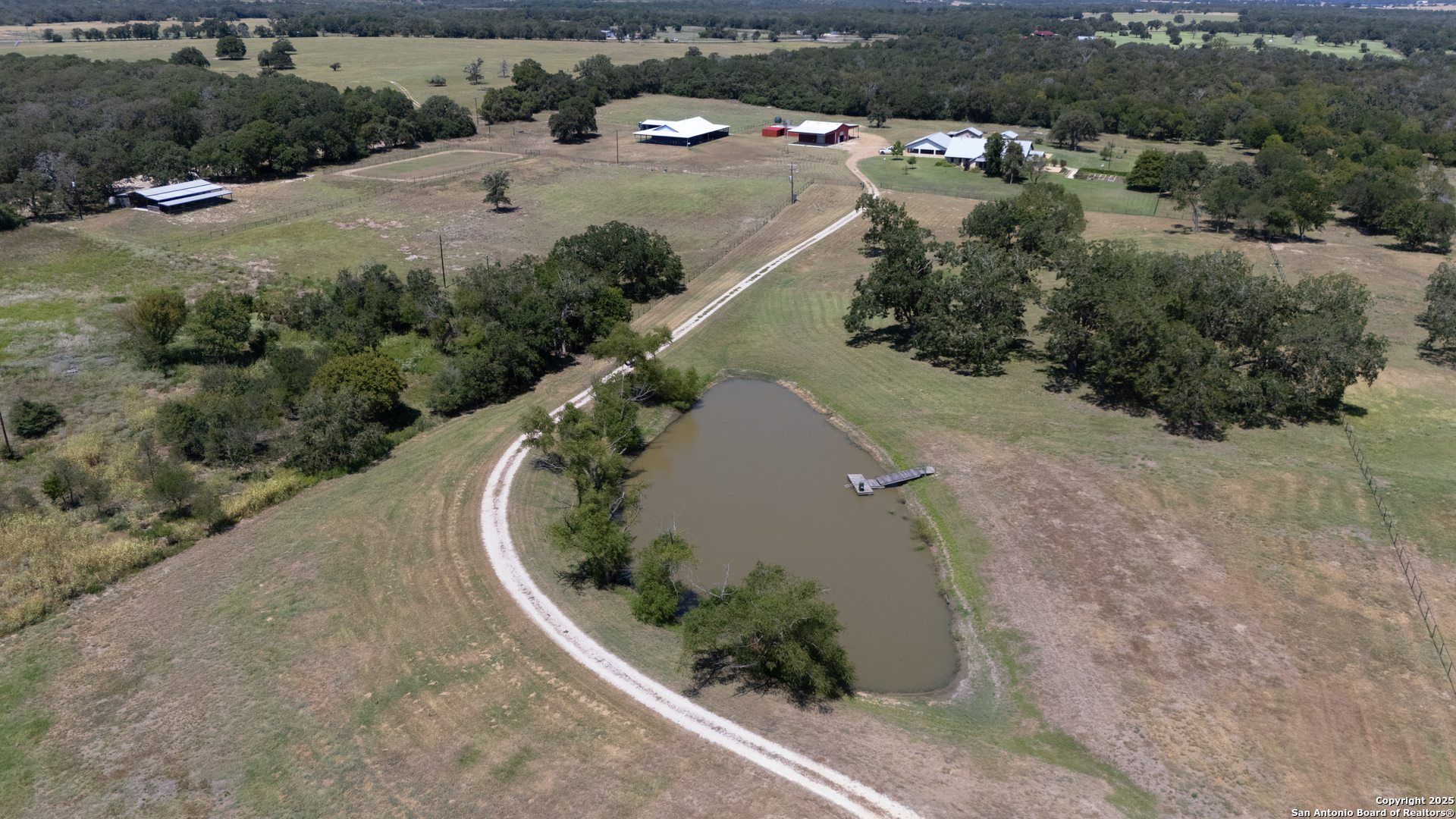 9560 Old Colony Line Road Dale, TX 78616 - Photo 34 of 41 an aerial view of a house with a yard and mountain view