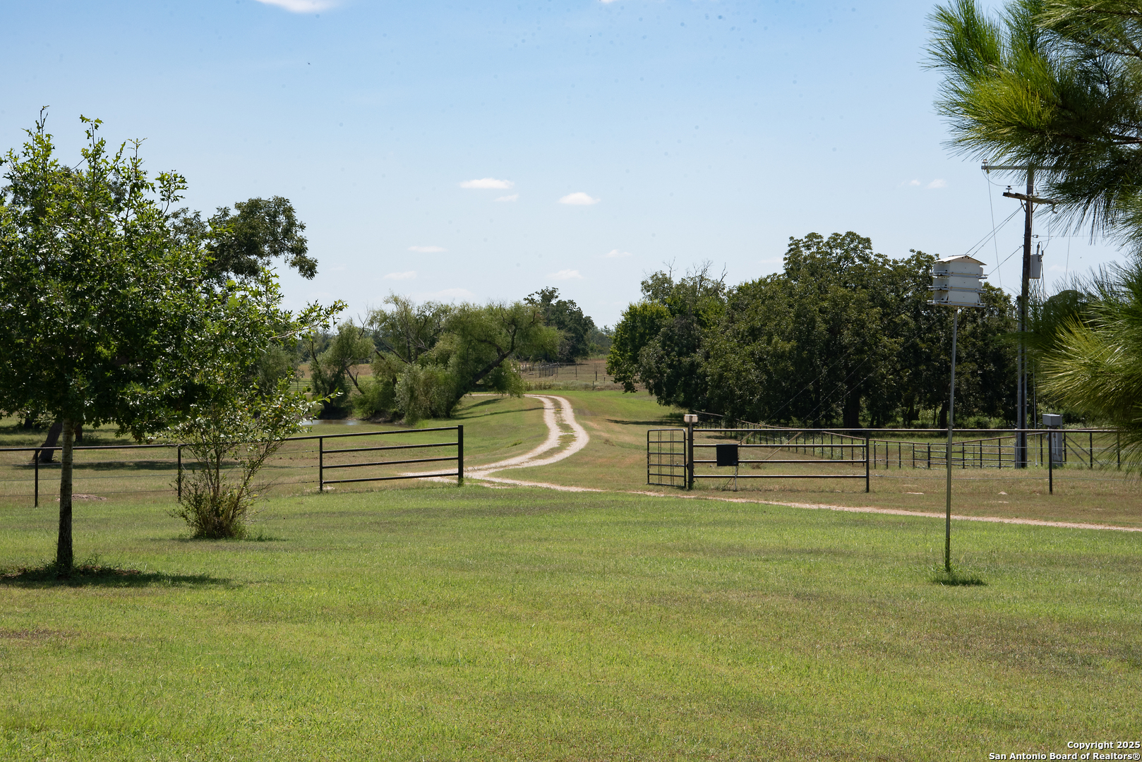 9560 Old Colony Line Road Dale, TX 78616 - Photo 38 of 41 a swimming pool with lots of tress in front of it