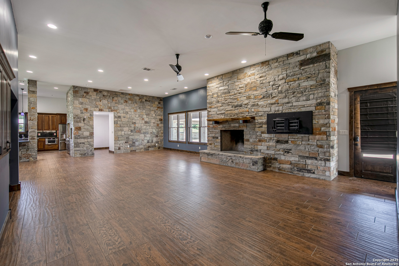 9560 Old Colony Line Road Dale, TX 78616 - Photo 9 of 41 a view of a livingroom with furniture a fireplace and wooden floor