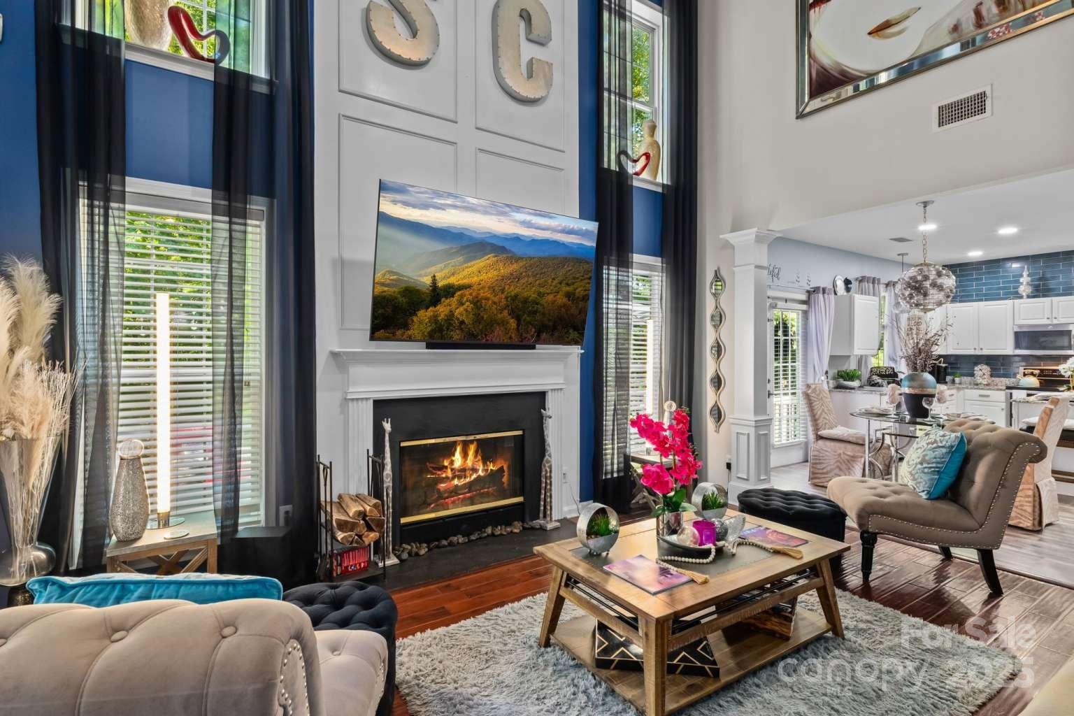 7828 Dunoon Lane Charlotte, NC 28269 - Photo 11 of 39 a living room with furniture and a fireplace