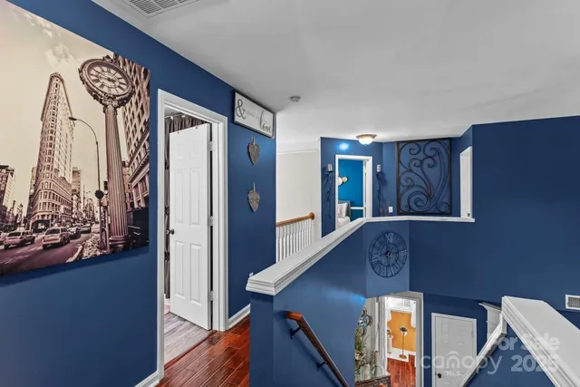 a view of an entryway with wooden floor