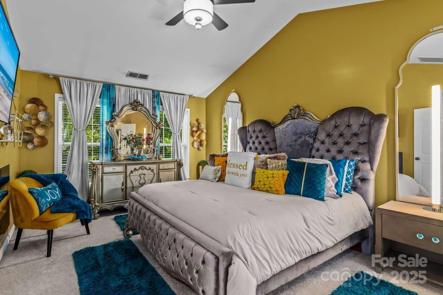 7828 Dunoon Lane Charlotte, NC 28269 - Photo 19 of 39 a bed room with two bed and a chandelier