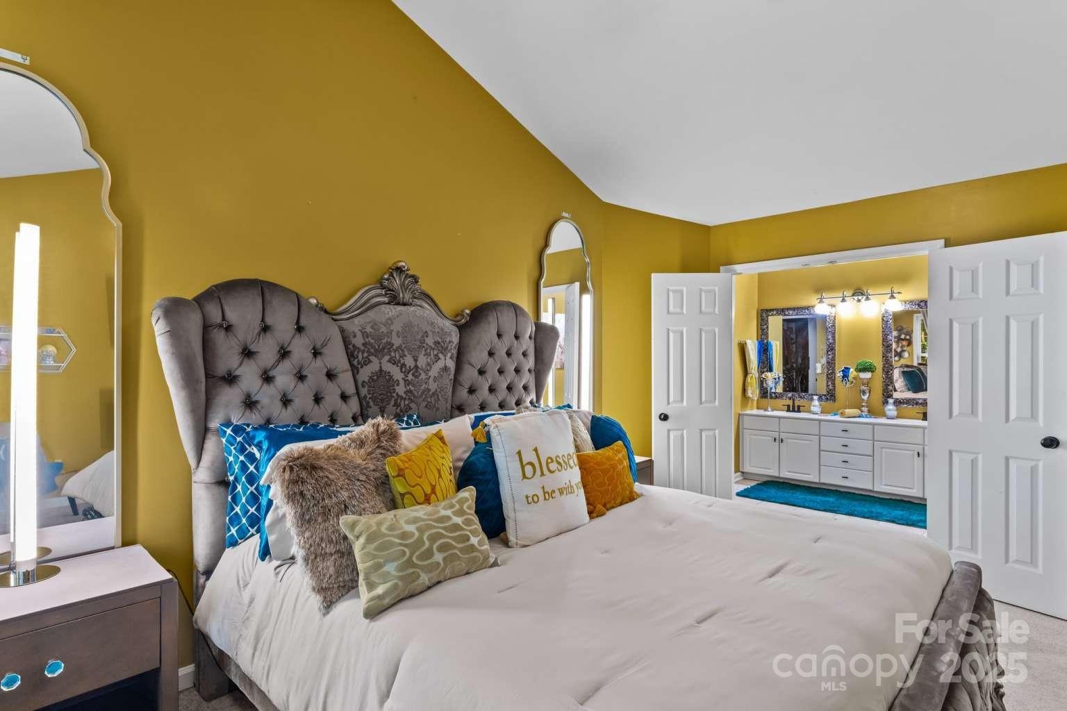 7828 Dunoon Lane Charlotte, NC 28269 - Photo 21 of 39 a bedroom with a bed and dresser with mirror