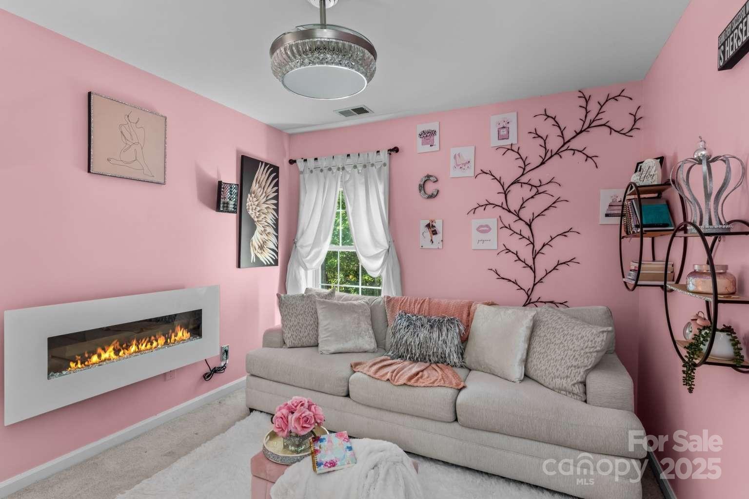 7828 Dunoon Lane Charlotte, NC 28269 - Photo 28 of 39 a living room with furniture and a couch