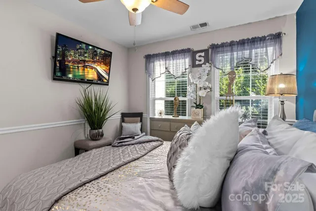 an outdoor sitting area with red umbrella