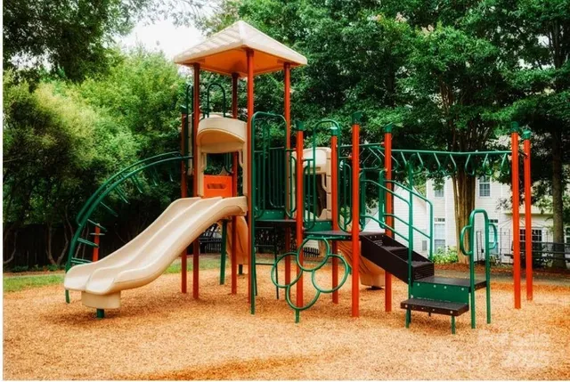 a aerial view of a house with swimming pool garden and patio