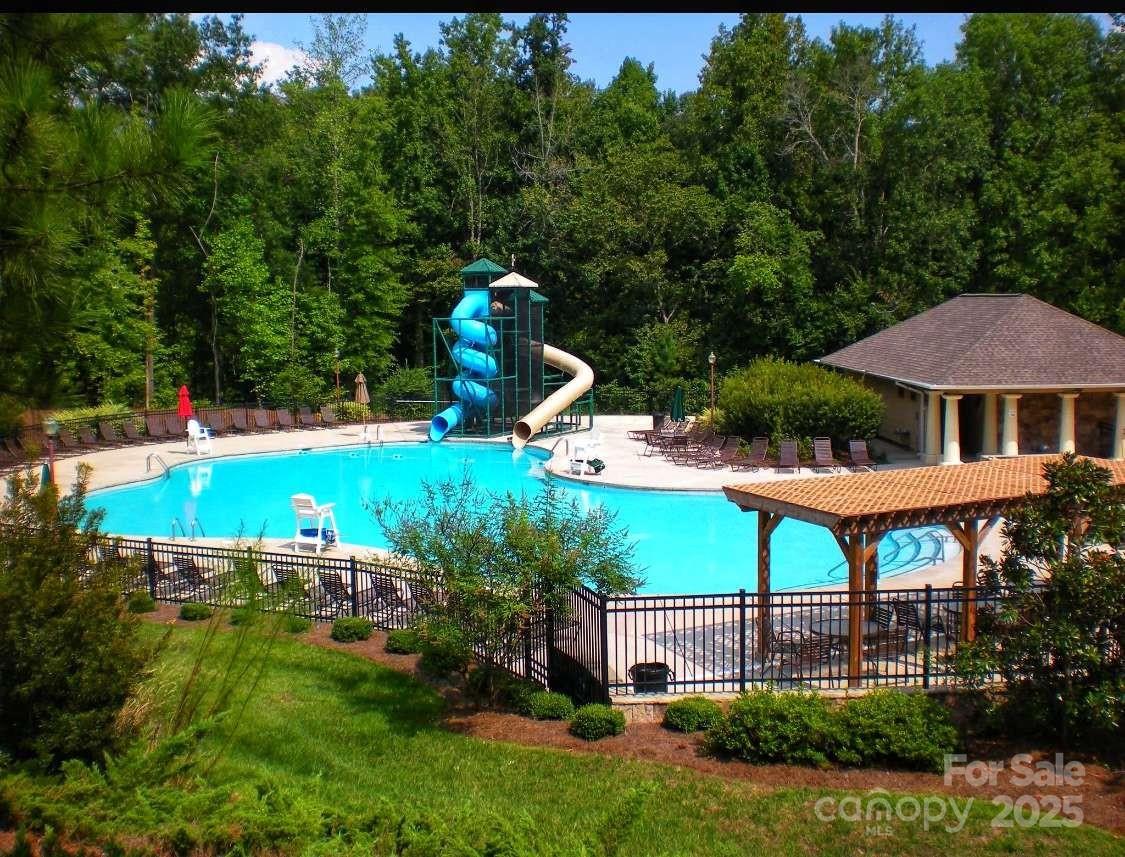 7828 Dunoon Lane Charlotte, NC 28269 - Photo 38 of 39 a aerial view of a house with swimming pool garden and patio