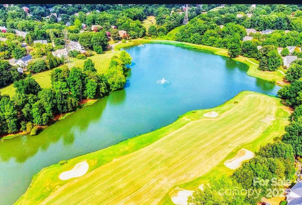 7828 Dunoon Lane Charlotte, NC 28269 - Photo 39 of 39 a view of a swimming pool with an outdoor space and seating area