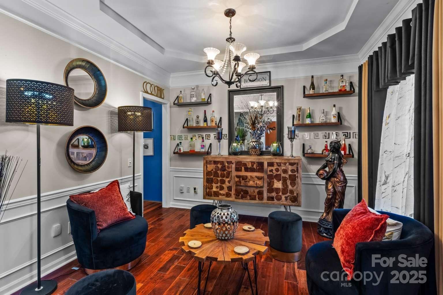 7828 Dunoon Lane Charlotte, NC 28269 - Photo 4 of 39 a view of a dining room with furniture and chandelier