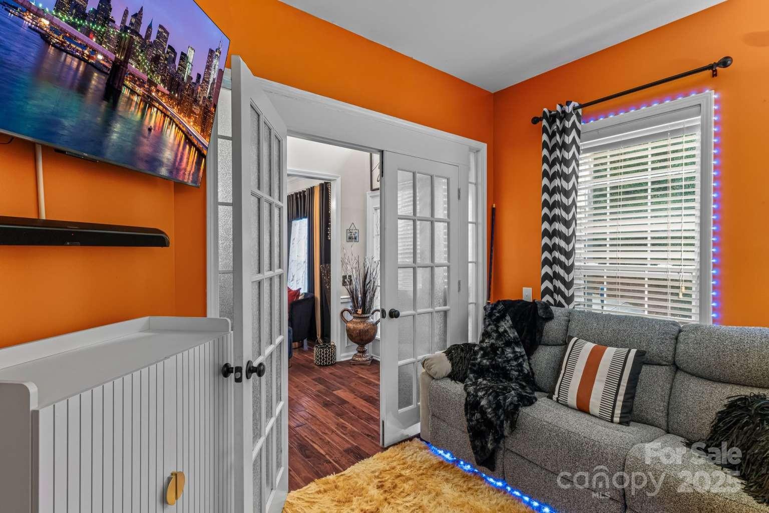 7828 Dunoon Lane Charlotte, NC 28269 - Photo 6 of 39 a view of a balcony with furniture and floor to ceiling window