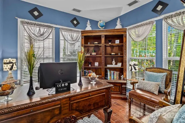 a work room with furniture and a window