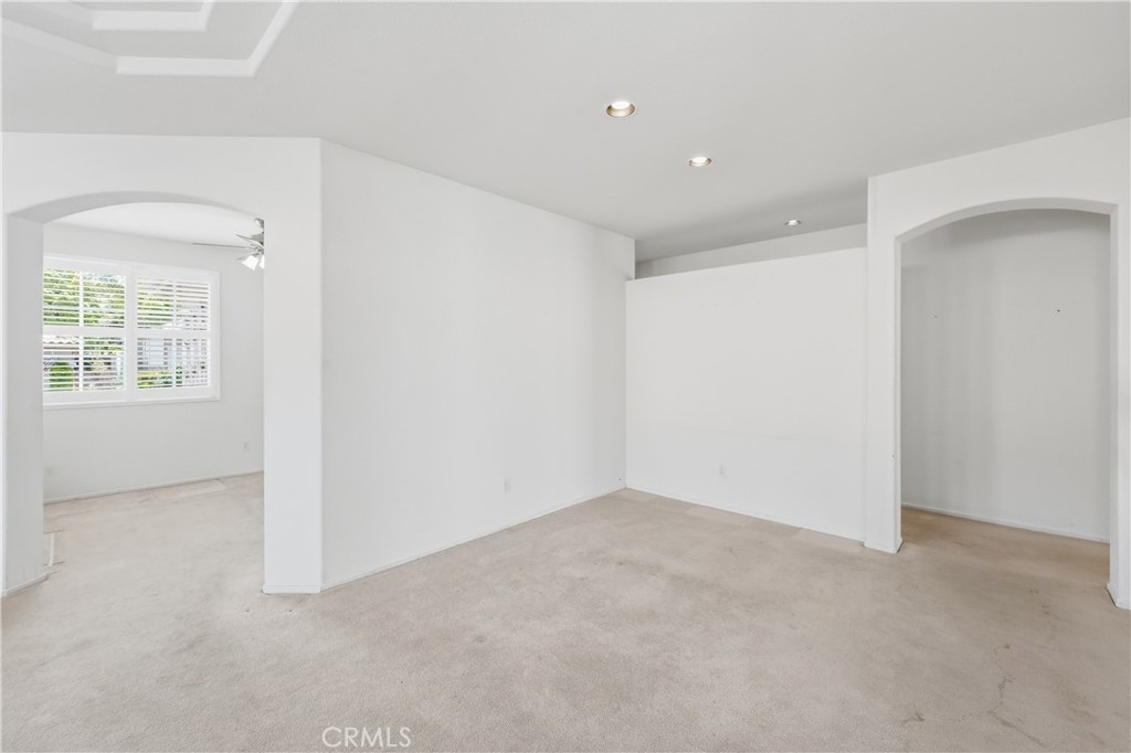 1961 Riviera Avenue Banning, CA 92220 - Photo 23 of 60 an empty room with windows
