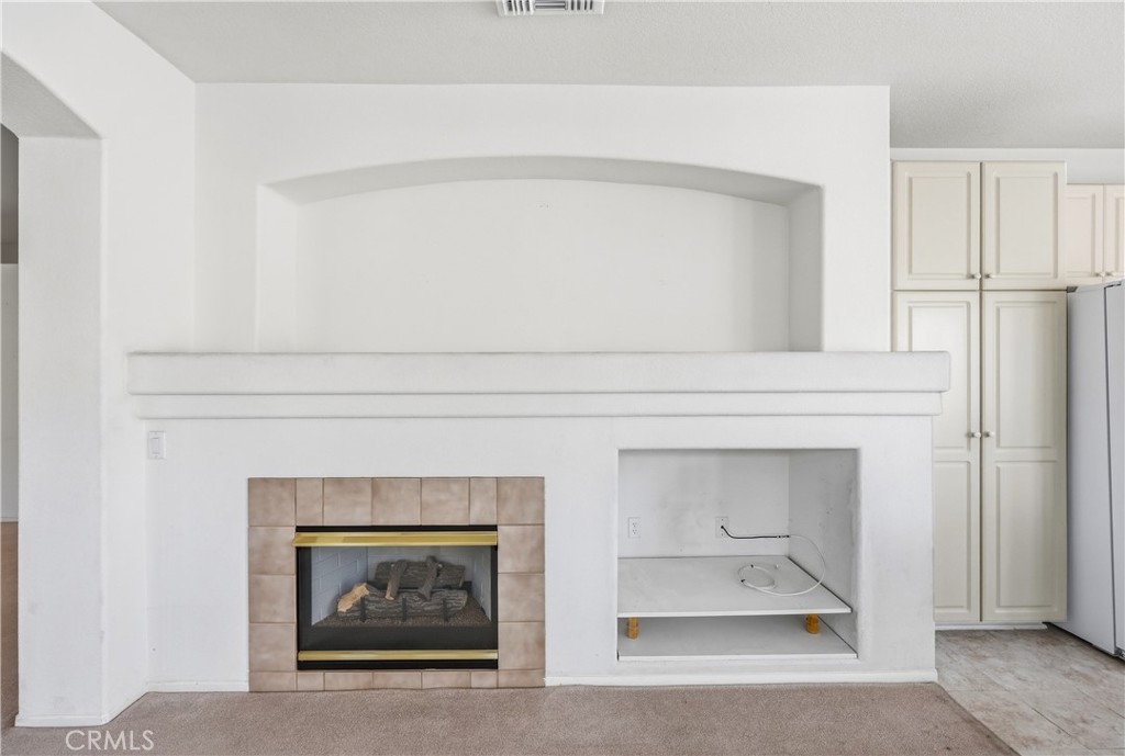 1961 Riviera Avenue Banning, CA 92220 - Photo 26 of 60 a living room with a fireplace