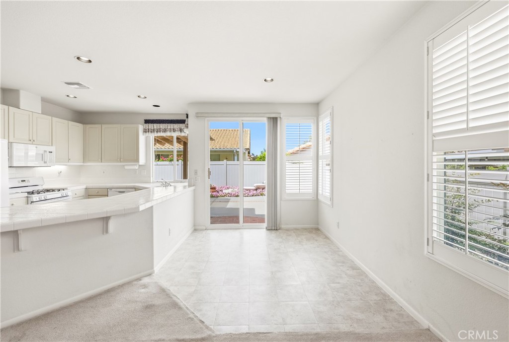 1961 Riviera Avenue Banning, CA 92220 - Photo 28 of 60 a view of kitchen with granite countertop cabinets and sink