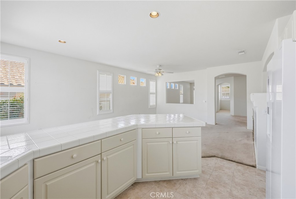 1961 Riviera Avenue Banning, CA 92220 - Photo 36 of 60 a spacious bathroom with a granite countertop sink mirror and next to a window