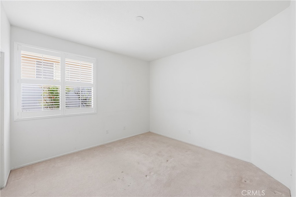 1961 Riviera Avenue Banning, CA 92220 - Photo 39 of 60 an empty room with a window