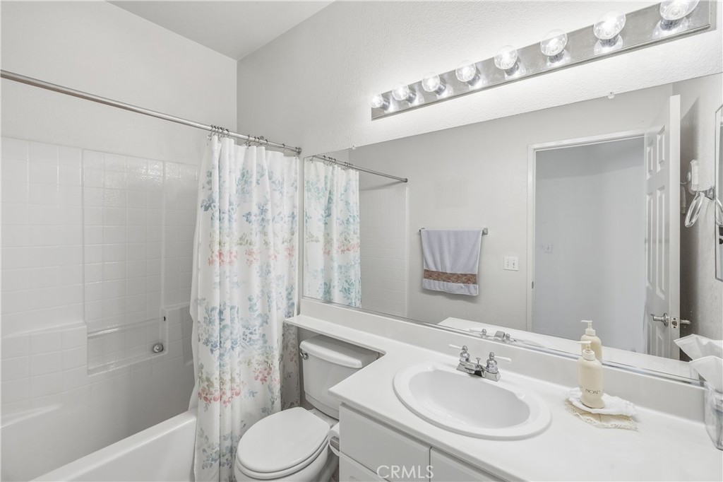 1961 Riviera Avenue Banning, CA 92220 - Photo 41 of 60 a bathroom with a sink toilet and shower