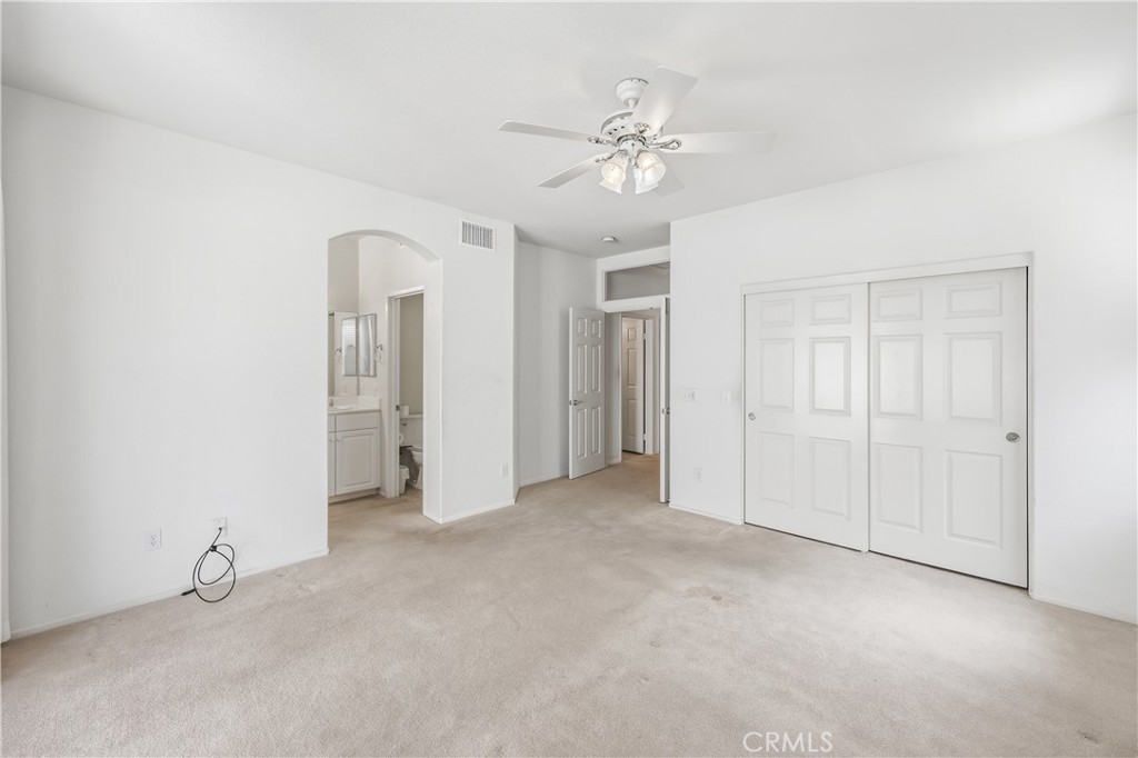1961 Riviera Avenue Banning, CA 92220 - Photo 44 of 60 a view of an empty room with a chandelier fan