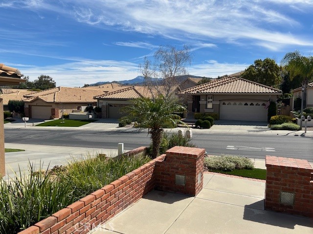 1961 Riviera Avenue Banning, CA 92220 - Photo 5 of 60 a front view of a house with a garden