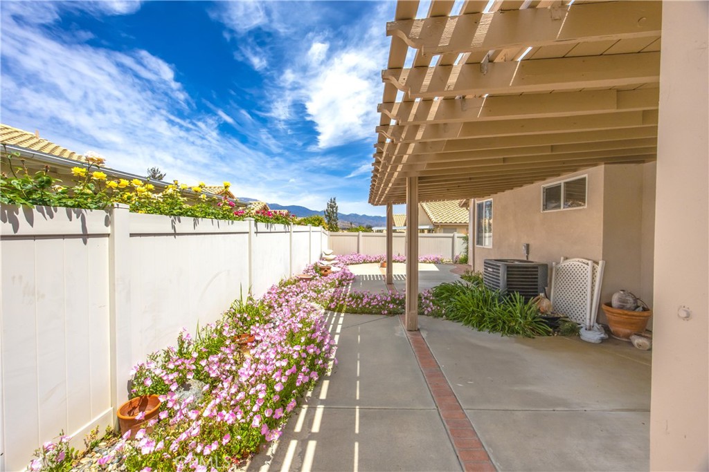 1961 Riviera Avenue Banning, CA 92220 - Photo 52 of 60 a view of a pathway with a bench in patio