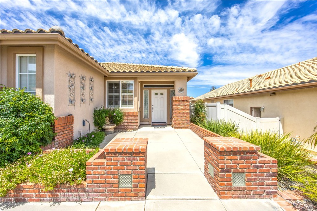 1961 Riviera Avenue Banning, CA 92220 - Photo 6 of 60 a front view of a house with garden