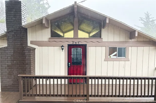 a view of a brick house with a large window