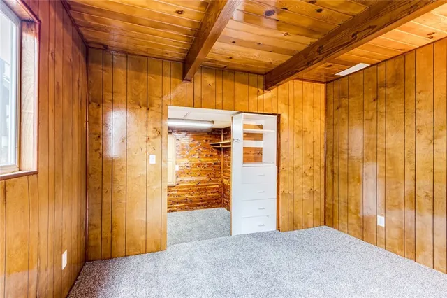 a view of a room with wooden walls