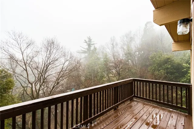 a view of balcony with wooden floor