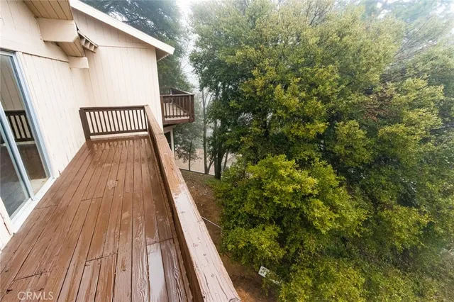 a view of balcony with wooden floor