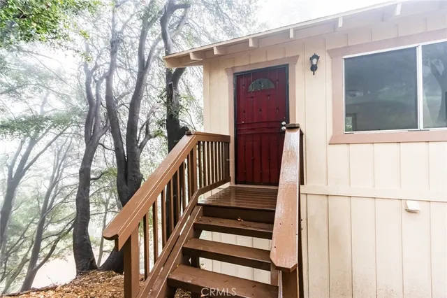 a view of entryway with wooden floor and stairs