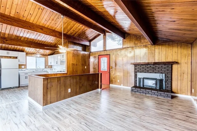 a view of kitchen with furniture and fireplace