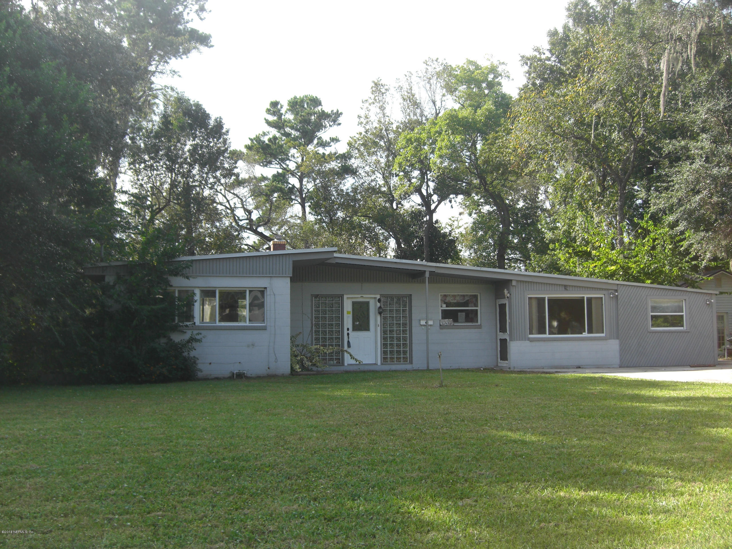 10586 Rutgers Road Jacksonville, FL 32218 - Photo 44 of 50 a view of house with a yard