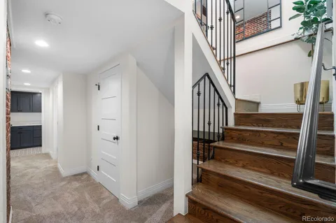 a view of entryway with wooden floor and stairs